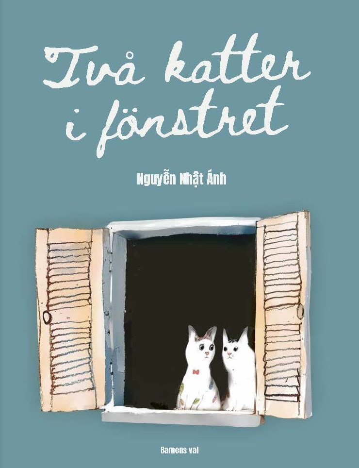 Två katter i fönstret